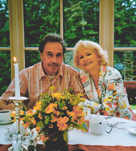 Photograph of Werner Wolf and his wife at a table with flowers